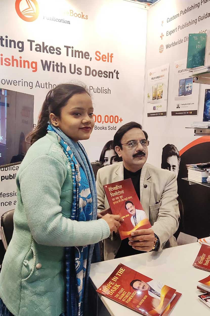 Readers meeting Dr. Rakesh Joshi at the OrangeBooks stall, NDWBF 2026