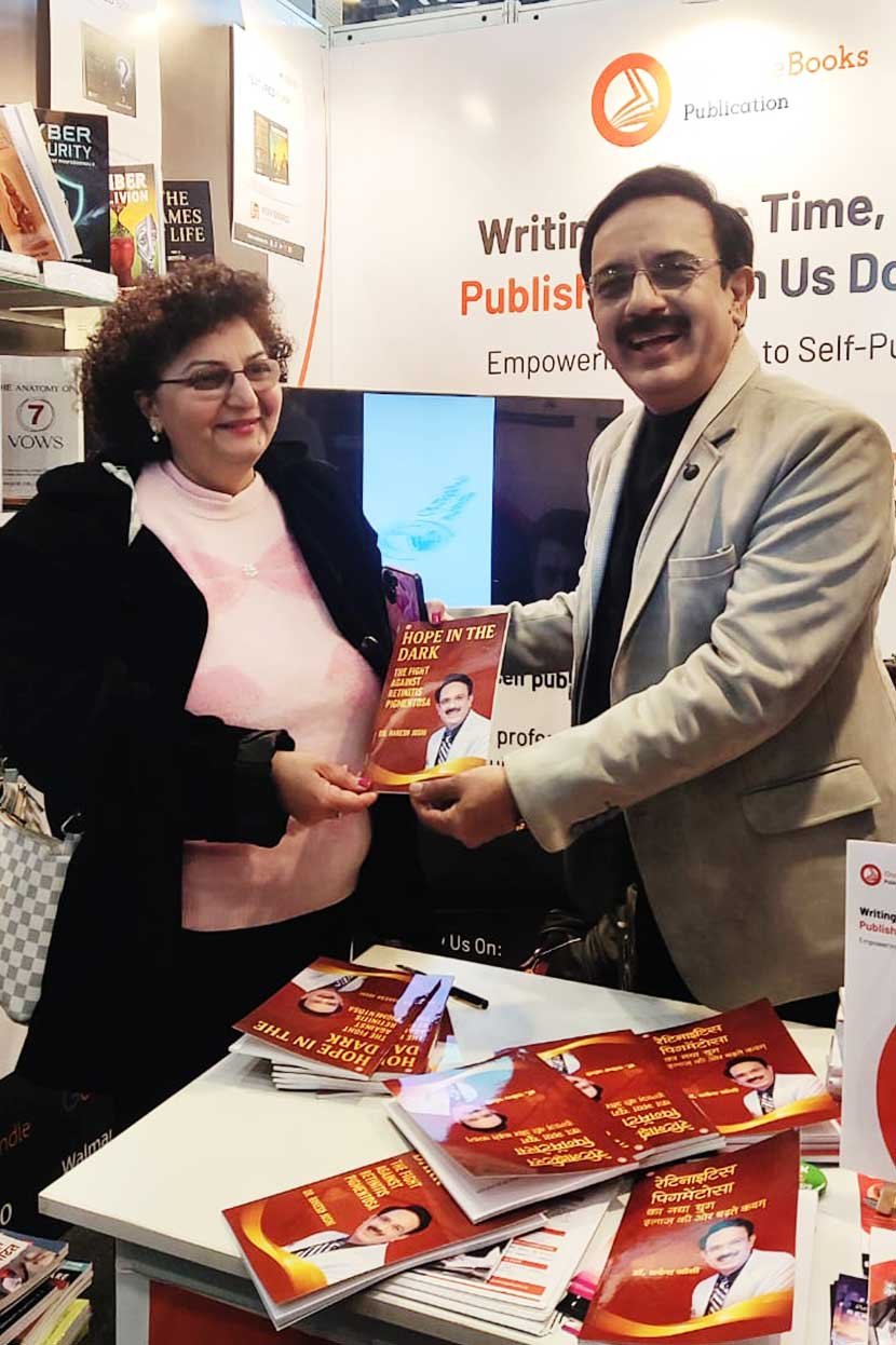 Dr. Rakesh Joshi with readers at the OrangeBooks stall, NDWBF 2026