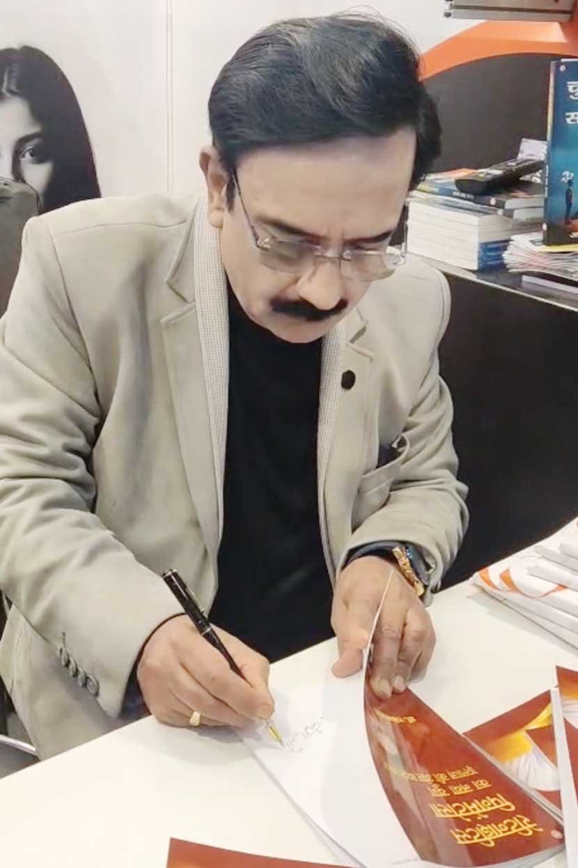 Dr. Rakesh Joshi signing copies at New Delhi World Book Fair 2026